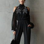 Black embroidered women's long-sleeve wide-leg jumpsuit by Plush Fashion Hub, showcasing a stylish casualwear outfit with intricate embroidery.