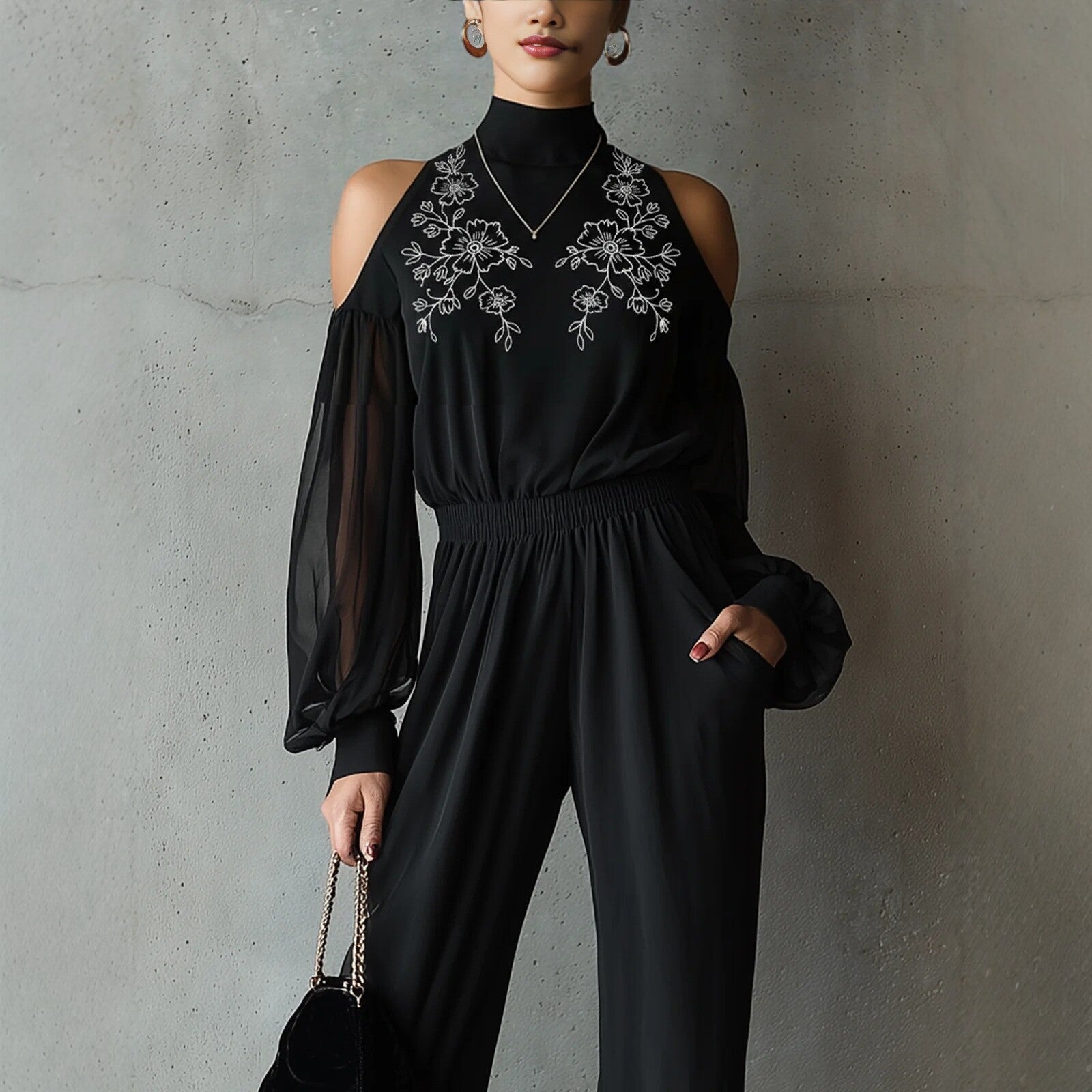 Black embroidered women's long-sleeve wide-leg jumpsuit by Plush Fashion Hub, showcasing a stylish casualwear outfit with intricate embroidery.