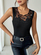 Black ribbed rhinestone-decorated vest T-shirt top, casualwear from Plush Fashion Hub, shown with a fitted design and sparkling embellishments.