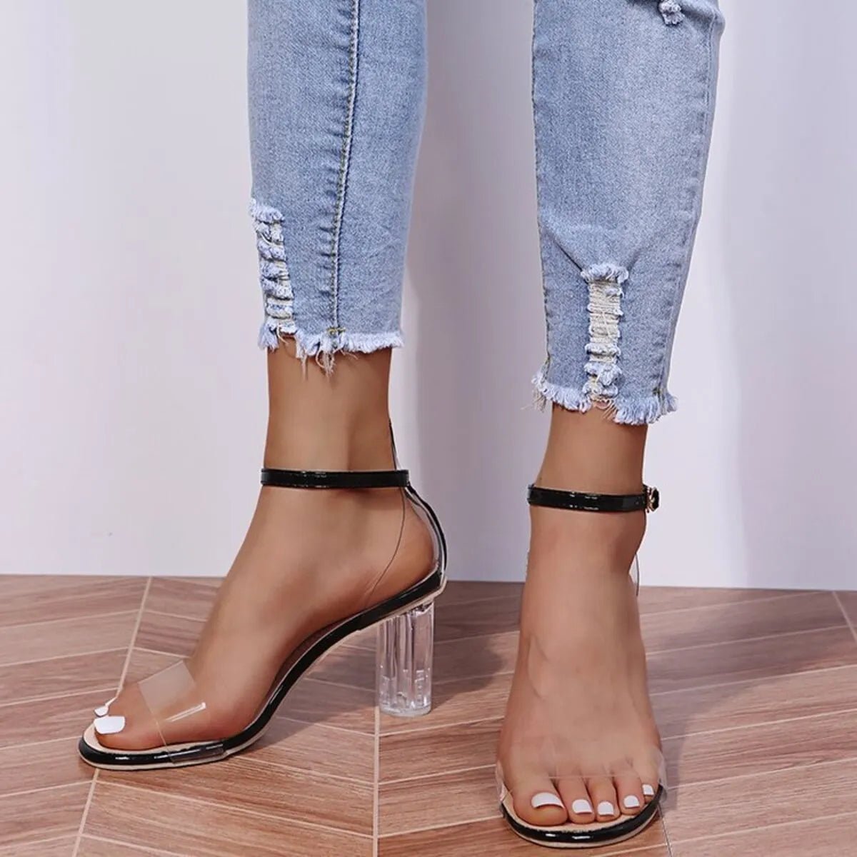 Women's faux leather block heel ankle strap sandals by Trendsi featuring a stylish heel and comfortable fit.