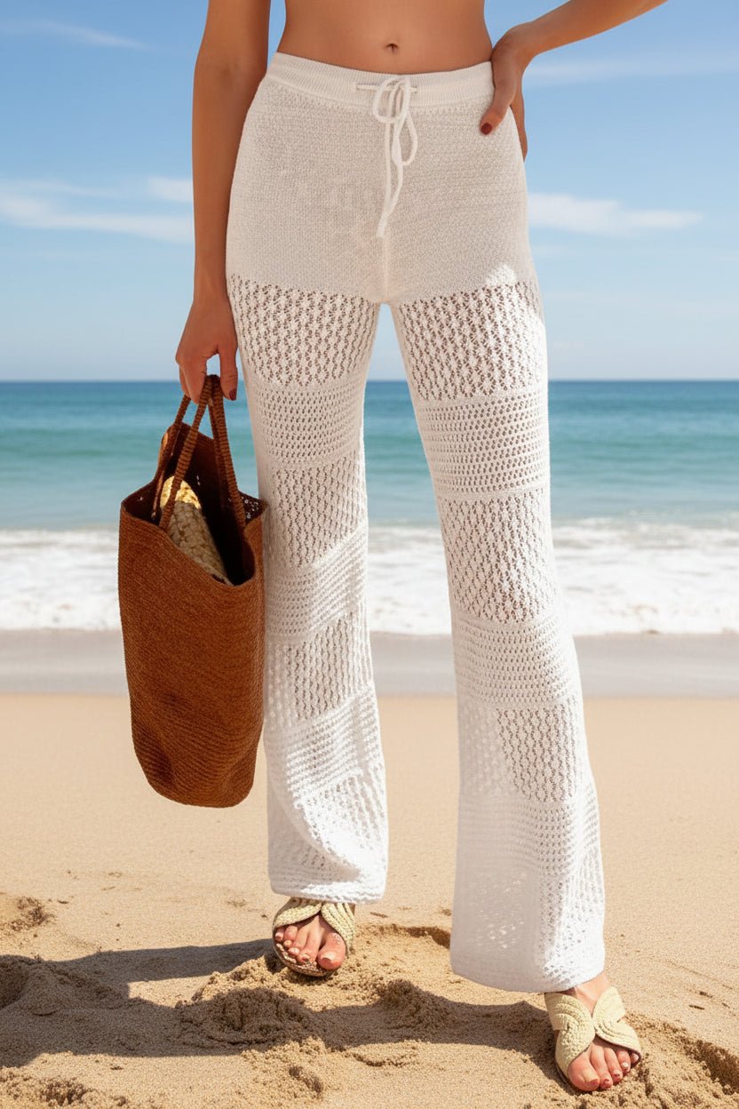 Boho crochet knit beach cover-up pants in lightweight, casualwear style with intricate open-knit pattern and relaxed fit.