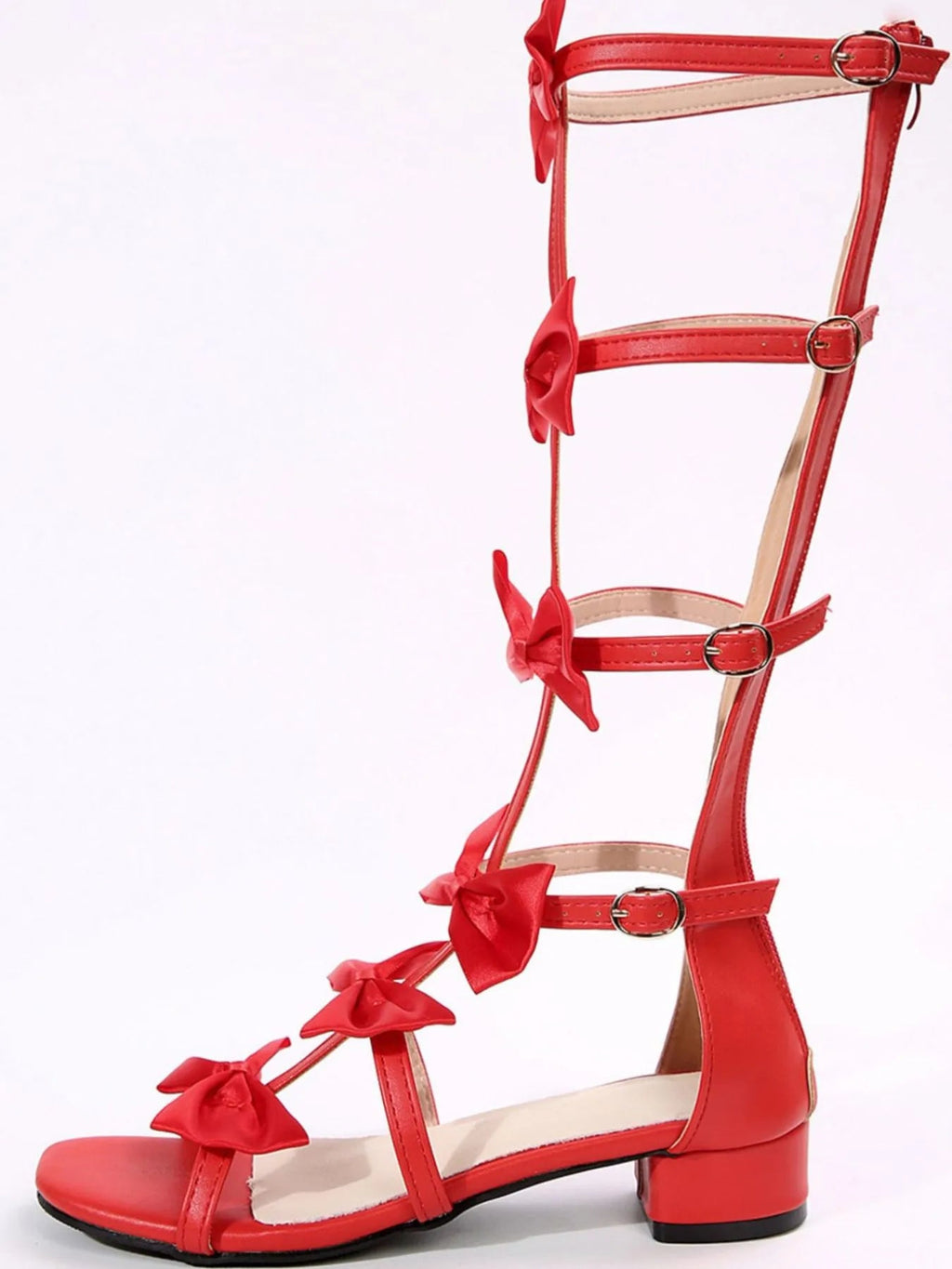 Women's low heel sandals with a bow detail, slip-on style, comfortable dress shoes by Trendsi, suitable for casual or formal wear.