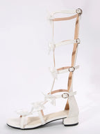 Elegant women's low heel sandals with bow detail, slip-on dress shoes by Trendsi, featuring comfortable, stylish design.