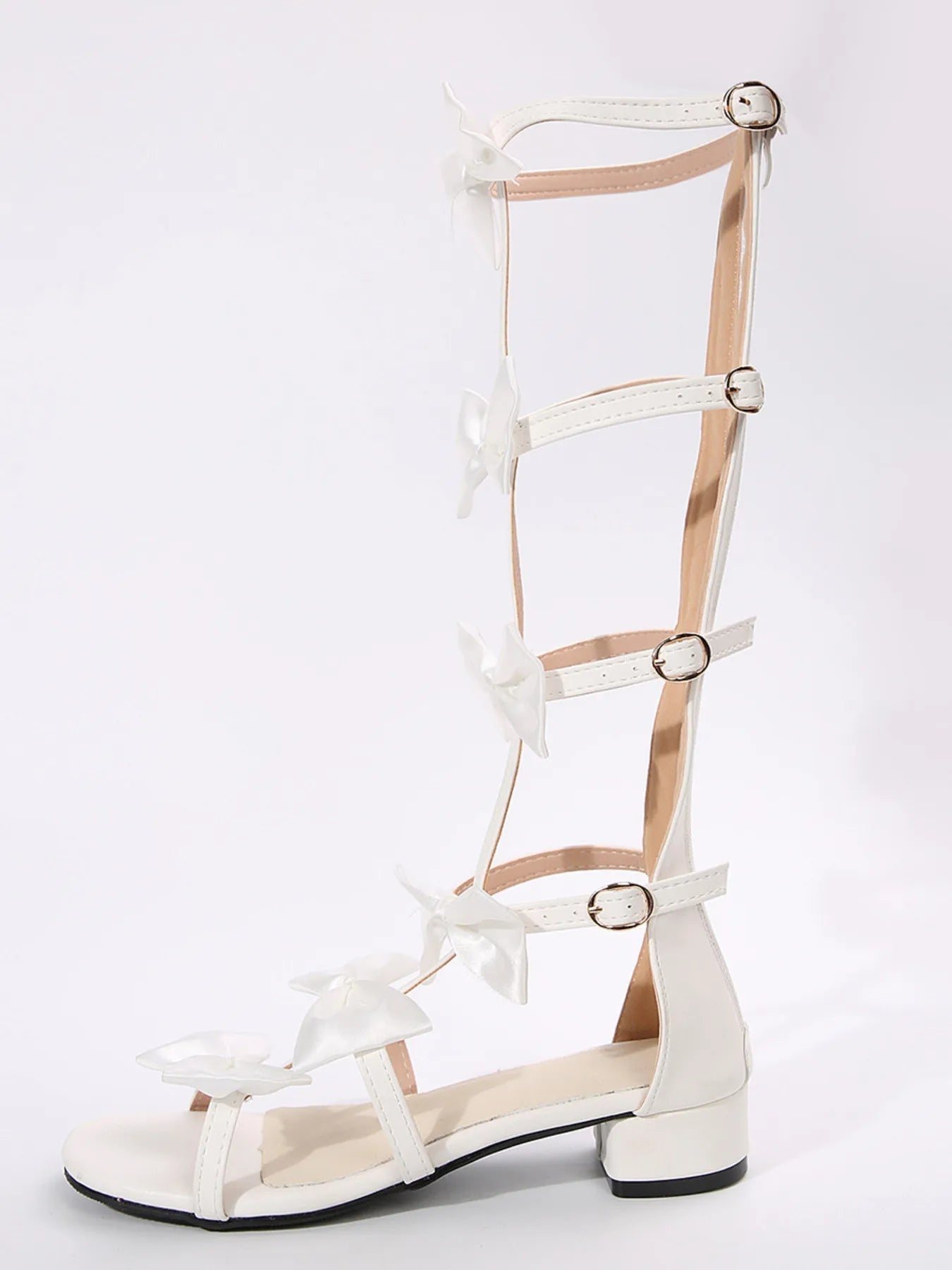 Elegant women's low heel sandals with bow detail, slip-on dress shoes by Trendsi, featuring comfortable, stylish design.