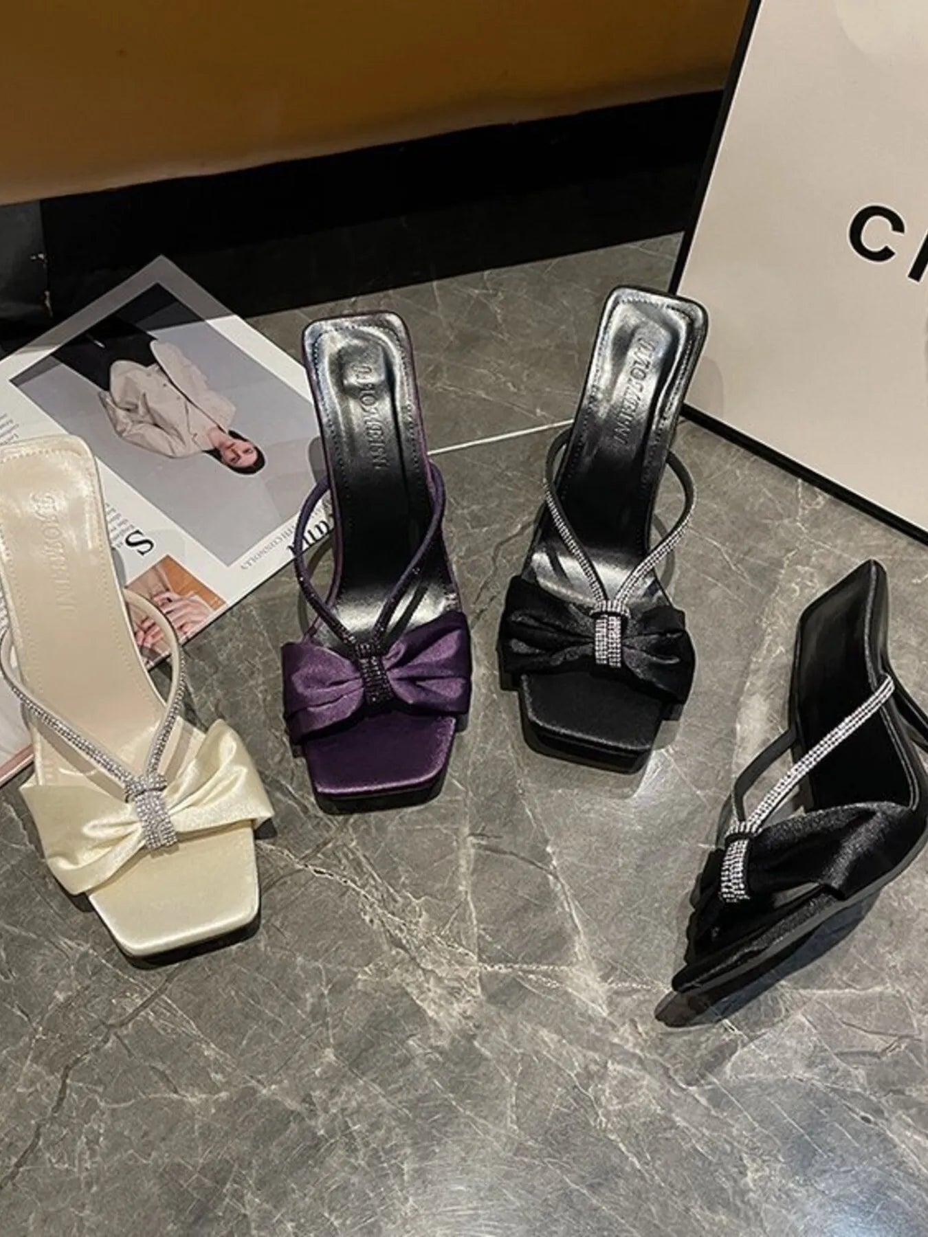 Elegant faux leather women's mid-heel sandals with bow detail, stylish and comfortable for casual or dressy occasions.