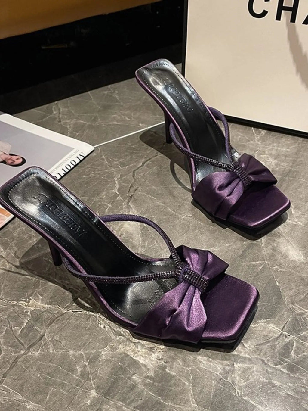 Elegant faux leather mid-heel sandals with bow detail for women, featuring a stylish and comfortable design by Trendsi.