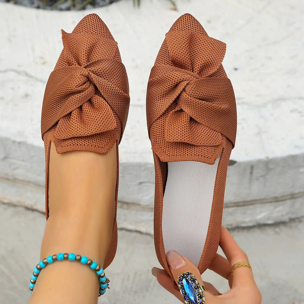 Elegant bow-embellished pointed toe flat slip-on shoes from Trendsi, featuring a stylish and comfortable design.