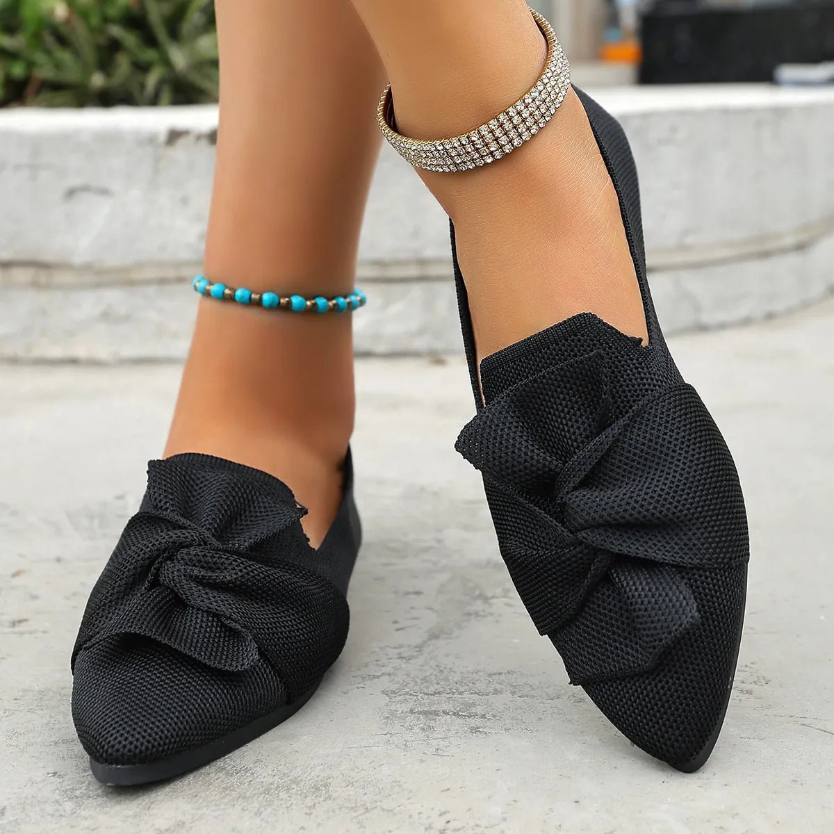 Elegant bow embellished pointed toe flat slip-on shoes by Trendsi featuring a stylish design and comfortable fit.