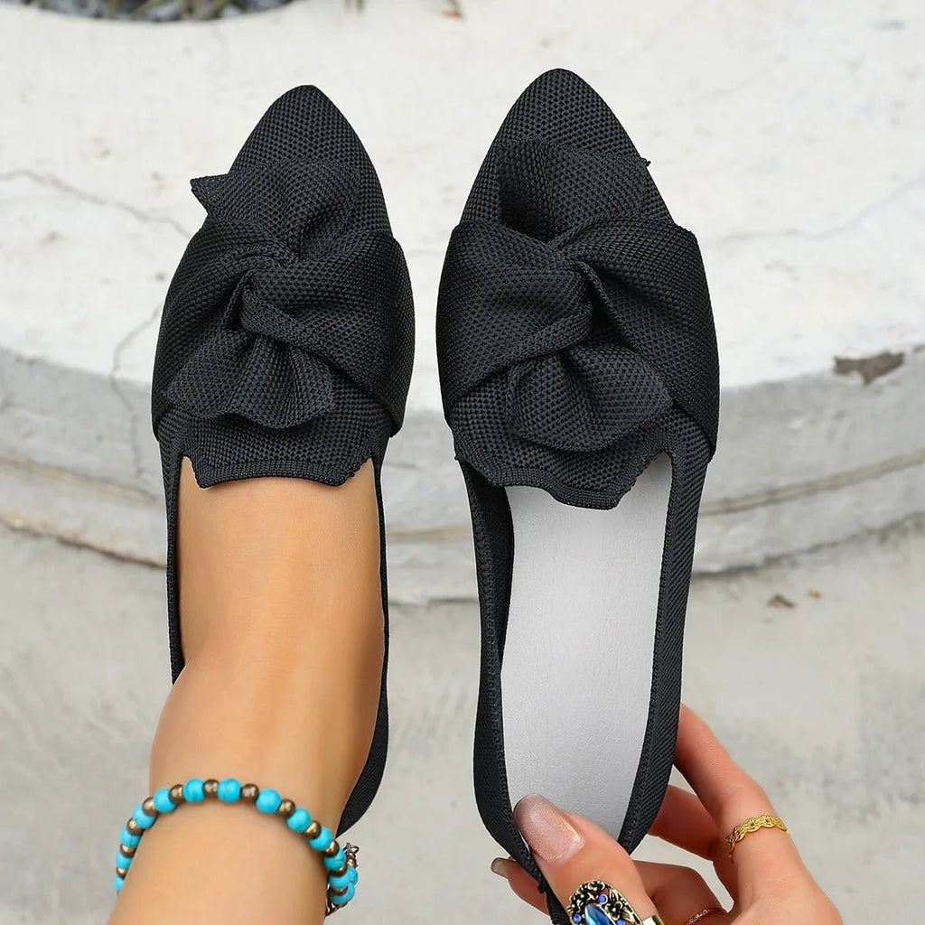 Elegant bow-embellished pointed toe flats slip-on shoes by Trendsi, featuring a sleek design and comfortable fit.