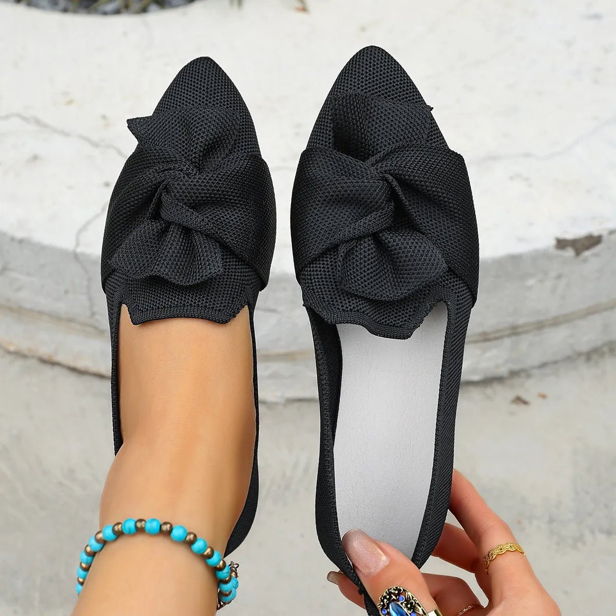 Elegant bow-embellished pointed toe flats slip-on shoes by Trendsi, featuring a sleek design and comfortable fit.