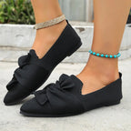 Elegant Trendsi pointed toe flat slip-on shoes with bow embellishment, perfect for stylish, comfortable everyday wear.