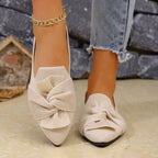 Elegant Trendsi pointed toe flat slip-on shoes with bow embellishment, perfect for stylish, comfortable everyday wear.
