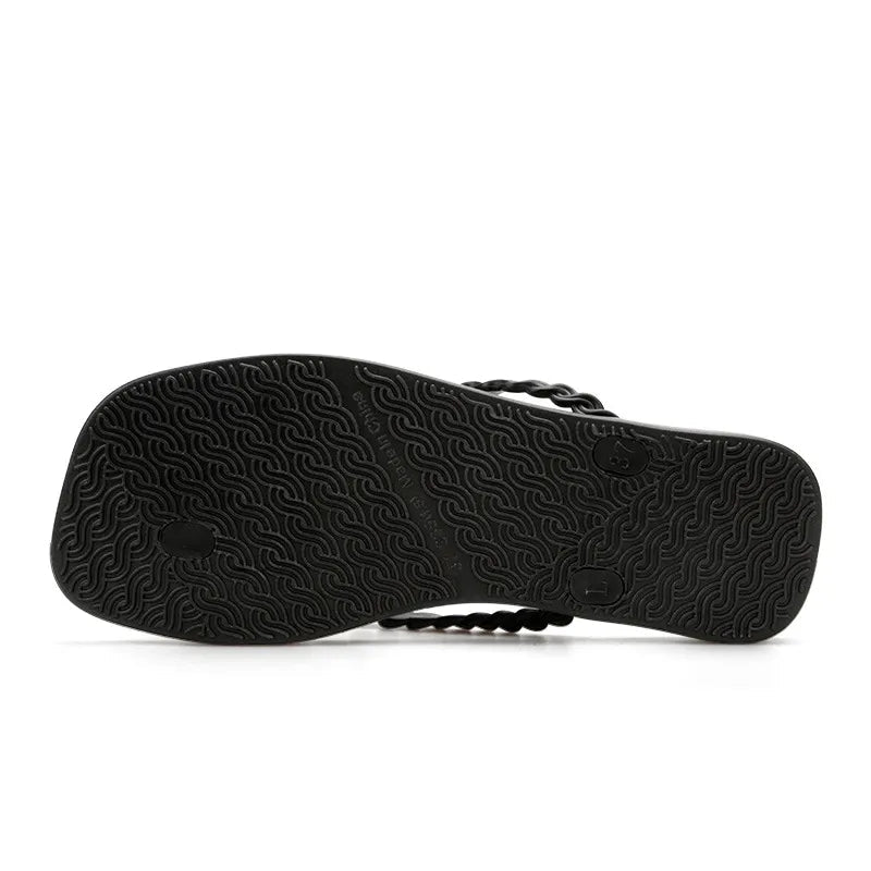 Women's braided strap beach sandals with toe post, comfortable summer flip flops by Trendsi, perfect for beach or casual wear.