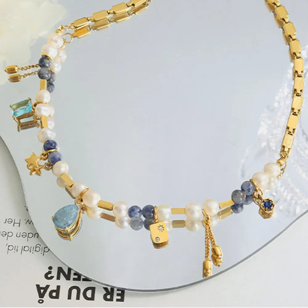 18K gold-plated beaded charm necklace featuring small decorative charms, designed for a stylish and elegant look.
