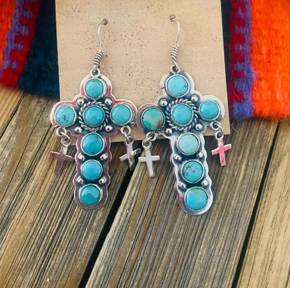 Turquoise cross-shaped earrings by Shopimist featuring vibrant artificial turquoise stones and silver-tone hooks.