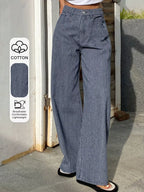 Shopimist striped wide-leg jeans with high waist and bold vertical stripes, styled with a casual fit and relaxed silhouette.