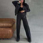 Women’s 2-piece zip-up sweatsuit set from Plush Fashion Hub featuring a casual zip-up jacket and wide-leg sweatpants.