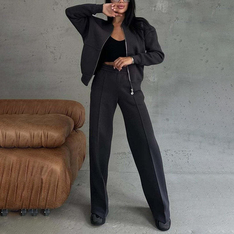 Women’s 2-piece zip-up sweatsuit set from Plush Fashion Hub featuring a casual zip-up jacket and wide-leg sweatpants.