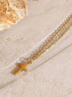 18K gold-plated three-layered cross necklace with delicate chain and detailed cross pendants, styled for elegant wear.