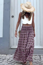 Geometric print smocked waist maxi dress from Plush Fashion Hub featuring a flowing silhouette and stylish pattern.