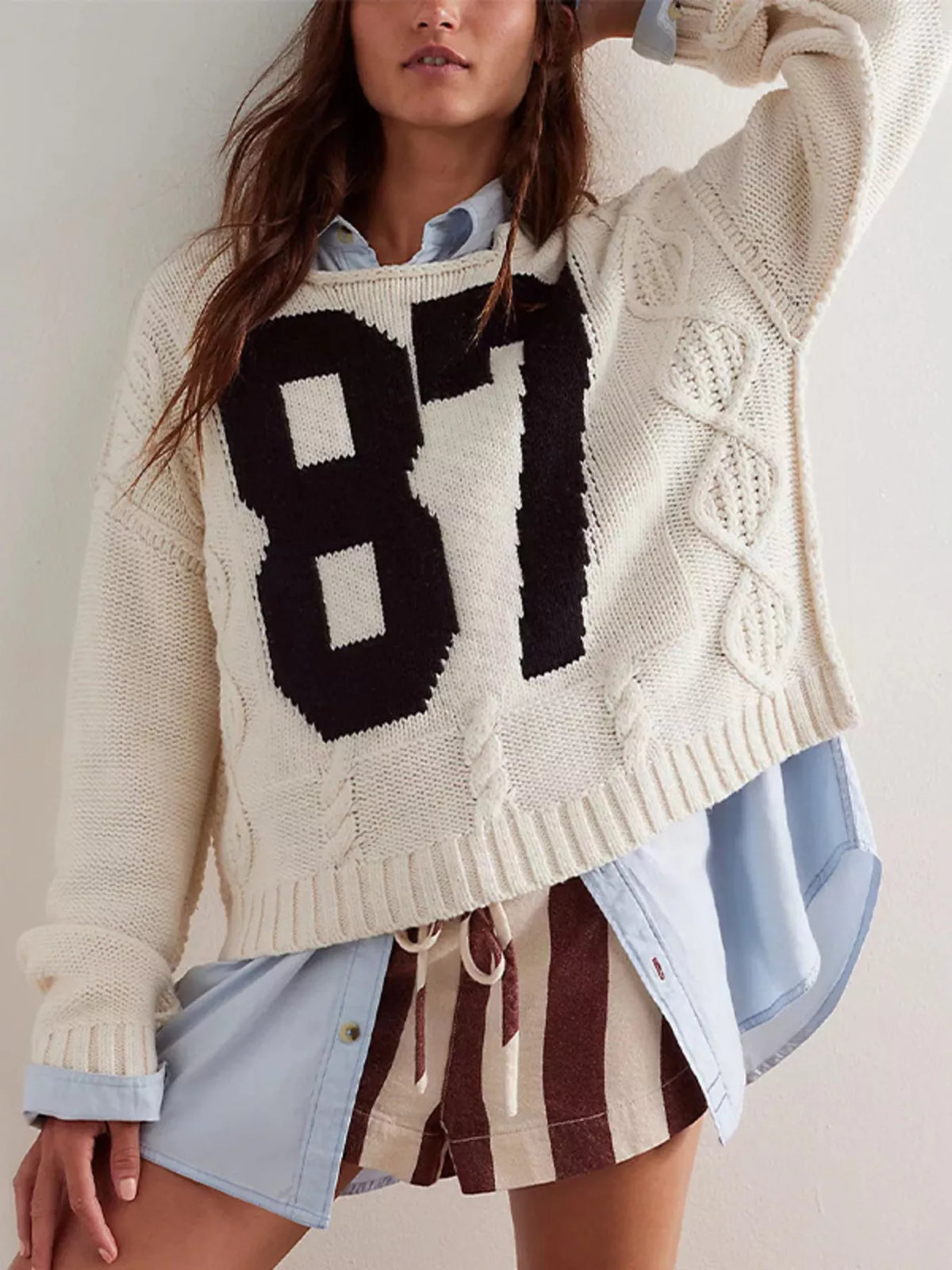 Cable-knit sweater featuring the number 78, stylish and cozy tops by Trendsi, with a classic knit pattern and a comfortable fit.