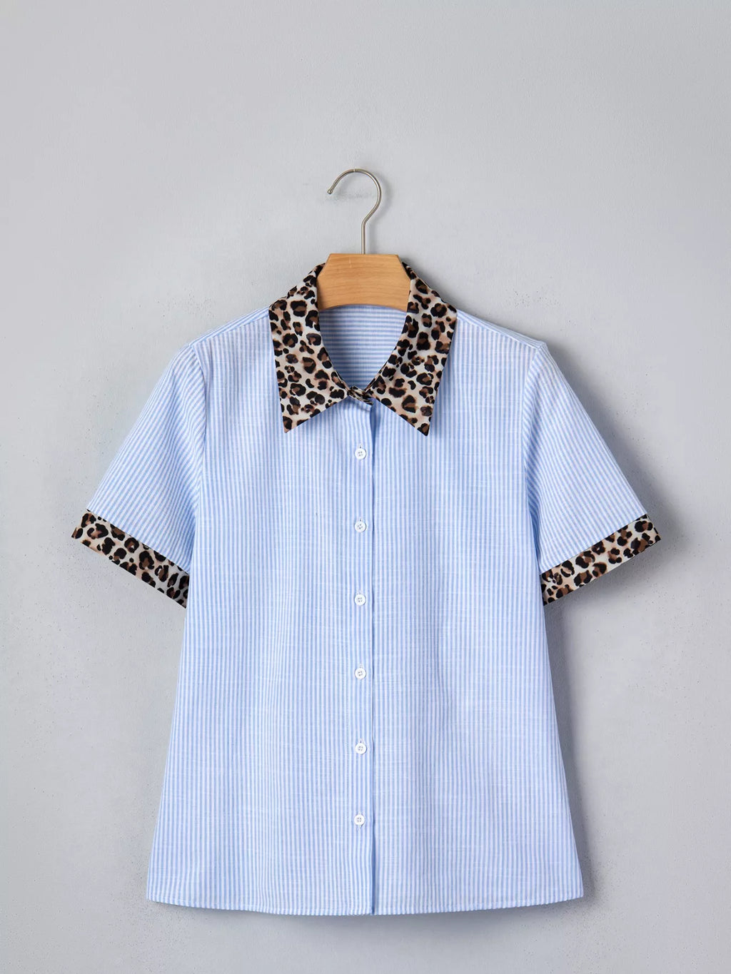 Women's leopard print short sleeve dress with contrast collar by Plush Fashion Hub, featuring a stylish and comfortable design.