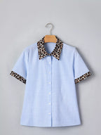 Women's leopard print short sleeve dress with contrast collar by Plush Fashion Hub, featuring a stylish and comfortable design.