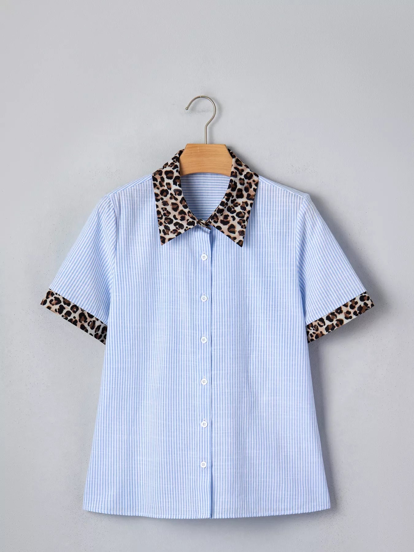 Women's leopard print short sleeve dress with contrast collar by Plush Fashion Hub, featuring a stylish and comfortable design.