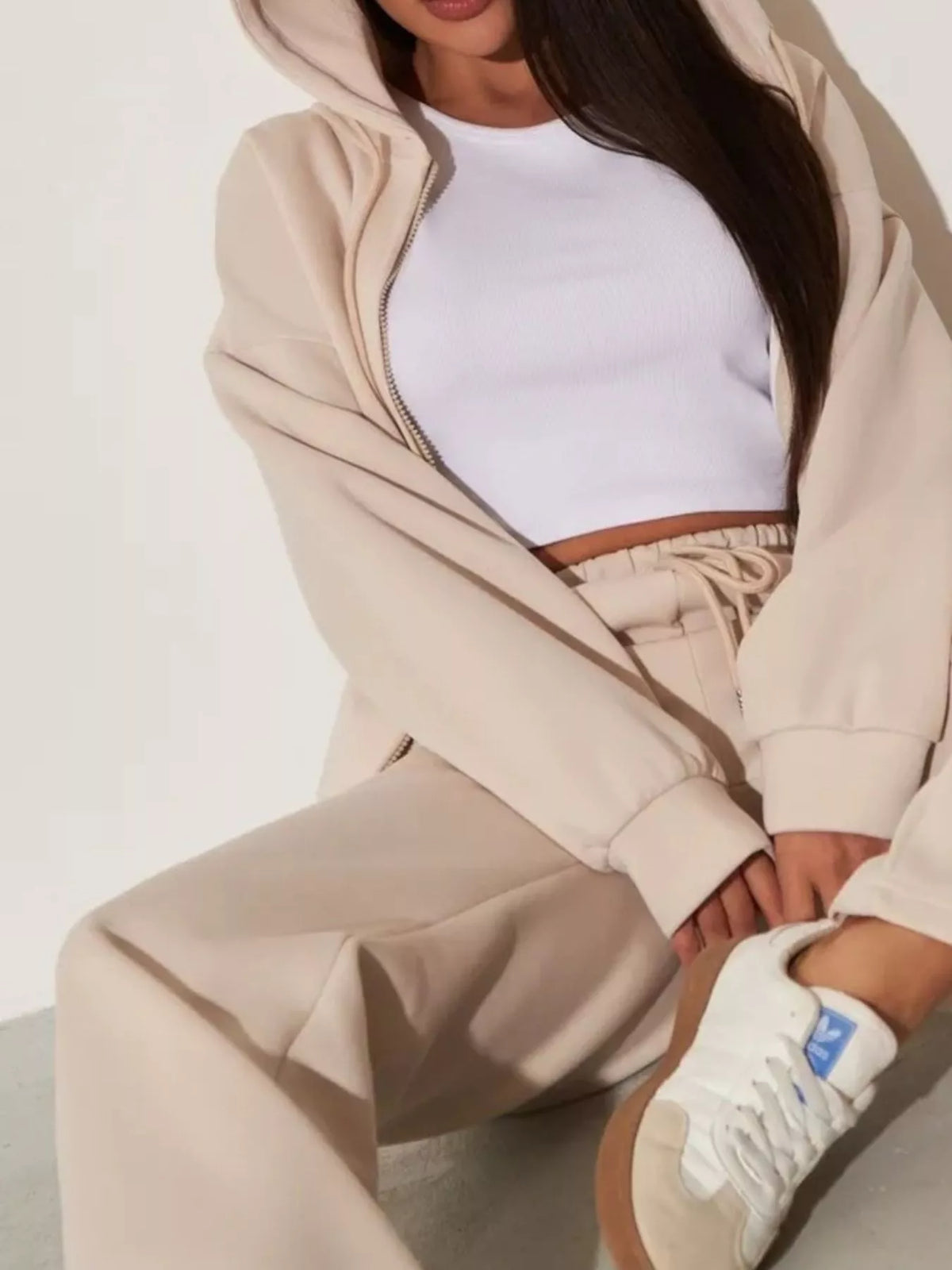 Plush Fashion Hub zip-up hoodie and wide-leg pants loungewear set, featuring cozy fabric and relaxed fit, displayed on a hanger.