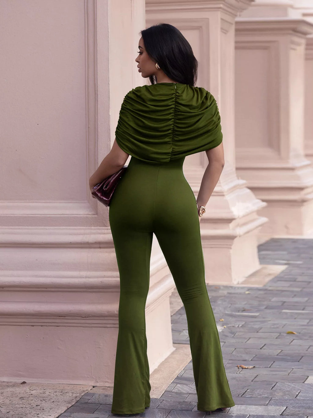 Ruched flare leg jumpsuit from Trendsi featuring a fitted bodice and flowing wide-leg design, perfect for stylish occasions.