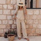 Women's embroidered V-neck top and wide-leg pants set by FitiqueFit, shown in five colors, featuring intricate embroidery and comfortable fit.