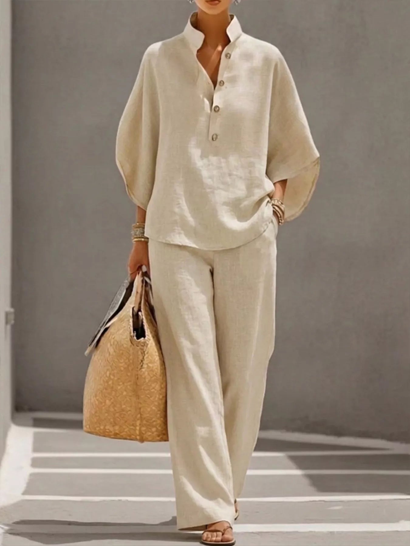 Plus size women's two-piece button-detail 3/4 sleeve top and pants set by Trendsi, shown in a stylish dress format.