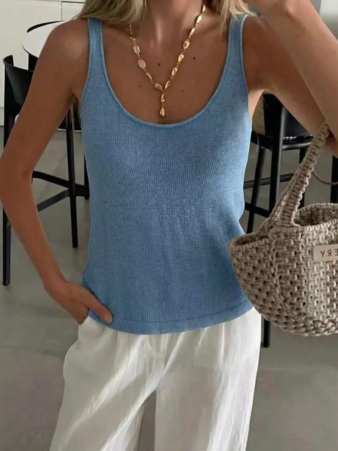 Scoop neck knit tank top from Trendsi featuring a soft, fitted design in a neutral color, perfect for casual wear.