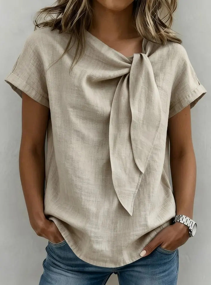 Women's loose-fit casual T-shirt by Plush Fashion Hub, short sleeve pullover in soft fabric, shown on a hanger.