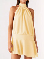 Backless halter neck dress with gathered waist by Plush Fashion Hub, featuring a stylish and elegant design suitable for formal occasions.