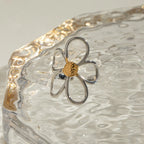Two-tone daisy flower ring by Shopimist featuring a gold and silver finish with detailed petal design.