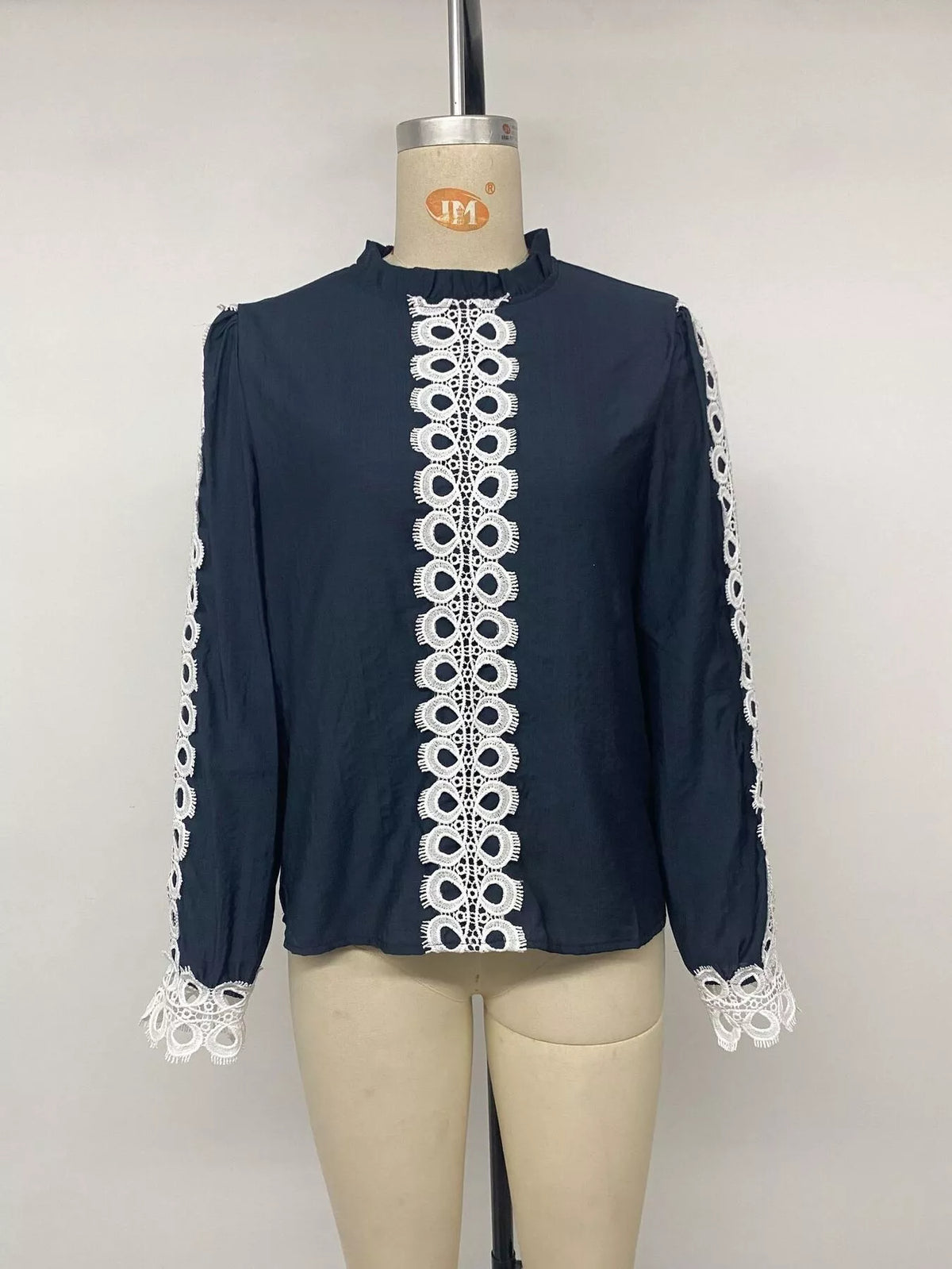 Lace trim long sleeves blouse from Trendsi featuring delicate lace details and a comfortable fit, ideal for casual or dressy wear.