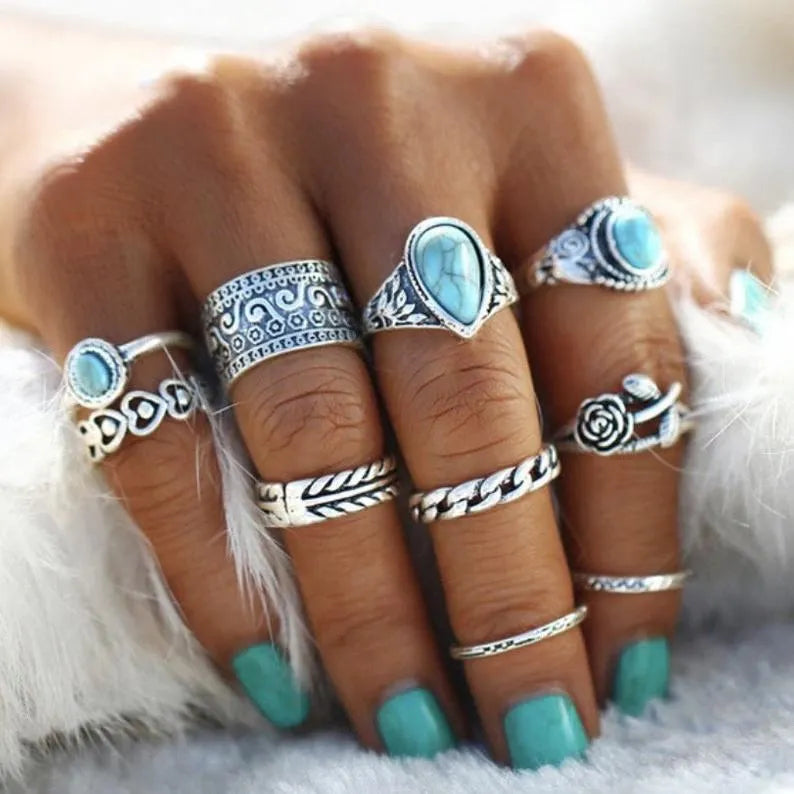 Set of ten artificial turquoise alloy rings featuring various stylish designs, perfect for jewelry and fashion accessories.