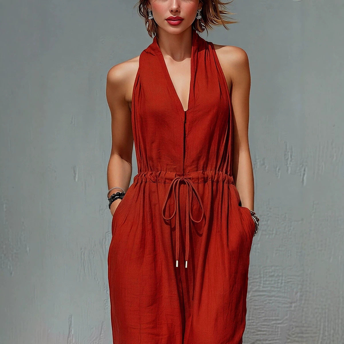 Women's sleeveless halter neck long jumpsuit in solid color, casualwear from Plush Fashion Hub, featuring a stylish fit and relaxed design.