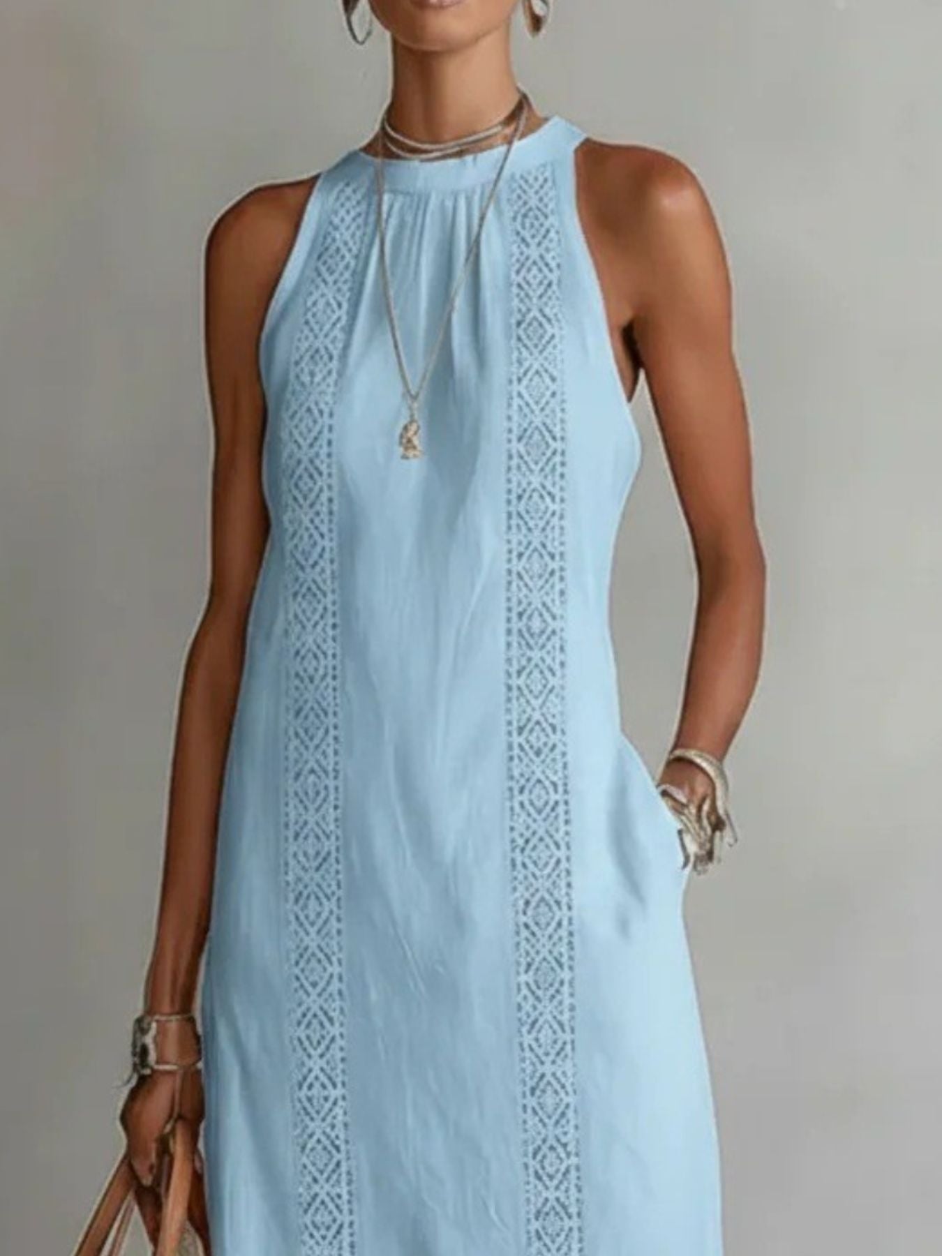 Sleeveless hollow-out midi dress by Plush Fashion Hub with side slit and pockets, shown on a model.