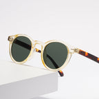 Retro round UV400 sunglasses with tinted European-style frames by FitiqueFit, featuring classic design and protective lenses.