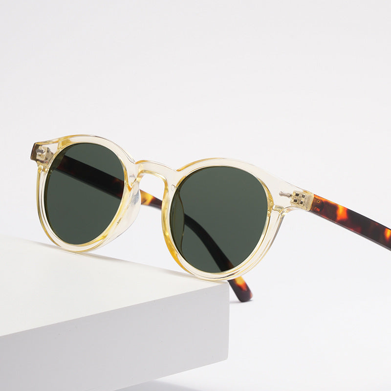 Retro round UV400 sunglasses with tinted European-style frames by FitiqueFit, featuring classic design and protective lenses.
