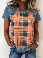 Denim patchwork short sleeve blouse from Plush Fashion Hub with mixed fabric designs and casual fit.