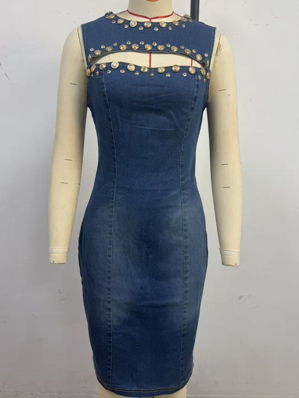 Sleeveless embellished cutout denim dress for women, featuring stylish design and trendy details, perfect for casual and chic looks.
