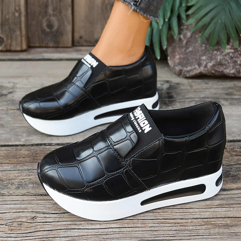 Women's crocodile pattern faux leather platform slip-on sneakers by Trendsi, casual sneakers with textured crocodile design.