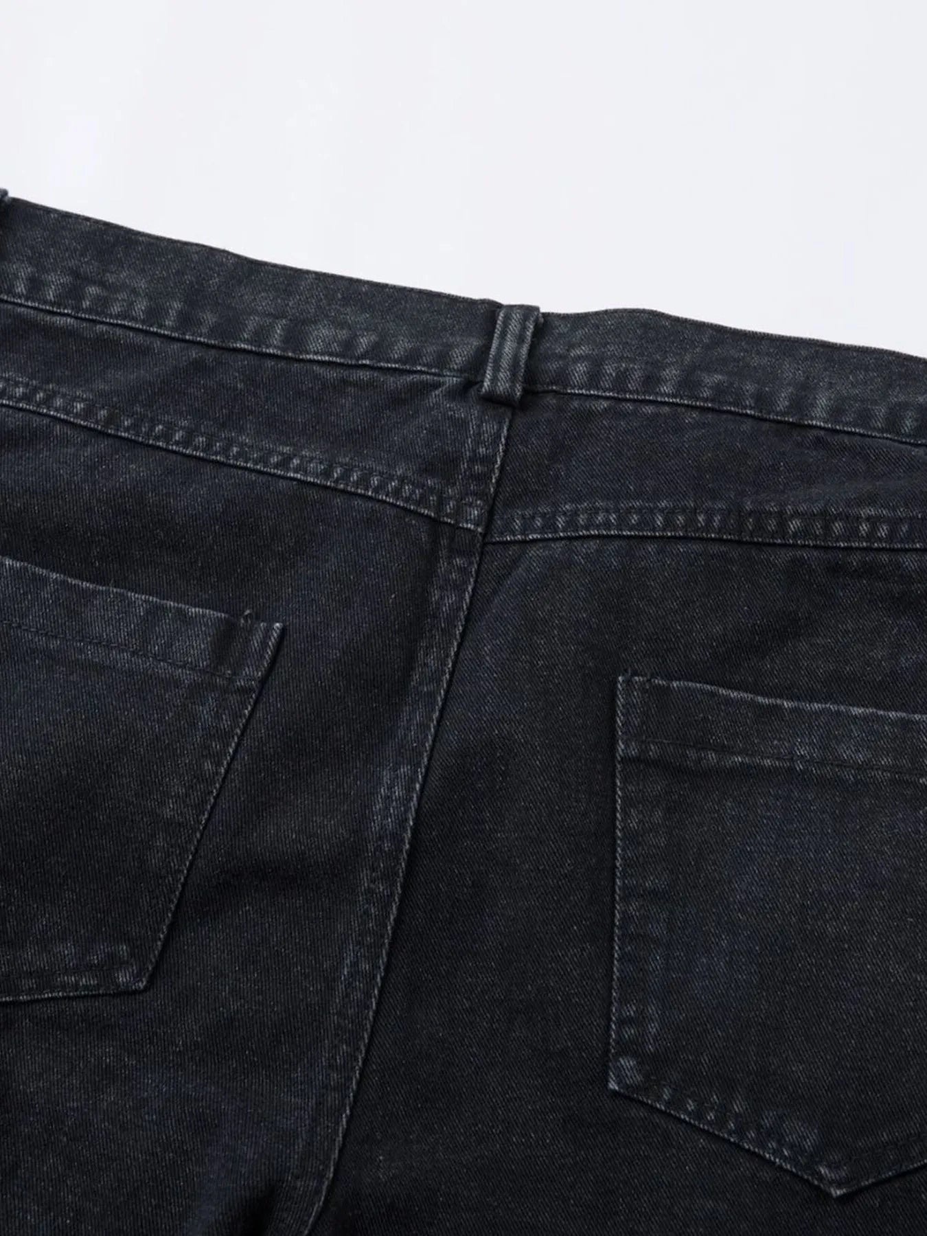 Men's wide leg denim jeans by Plush Fashion Shop, showing the relaxed fit and classic blue denim fabric.