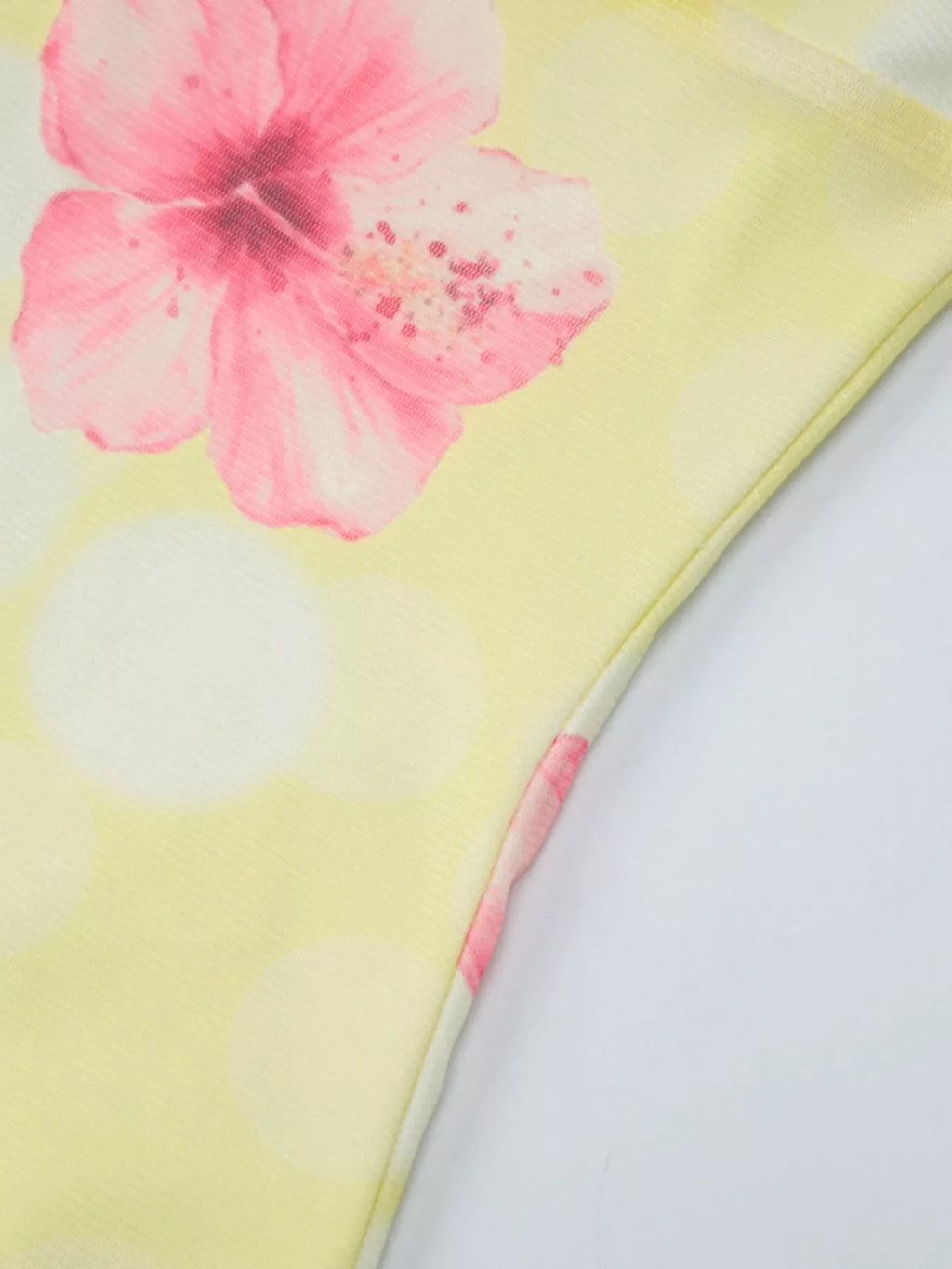 Sheer floral print sleeveless asymmetrical mini dress by Shopimist showcasing a flowy, lightweight design with vibrant floral patterns.