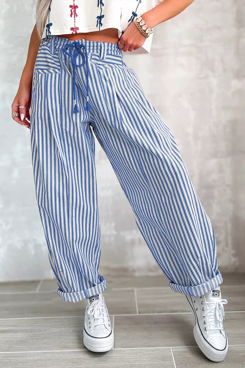 Casual loose Stripe Drawstring Pants by Trendsi showing relaxed fit with adjustable waistband in a neutral fabric.