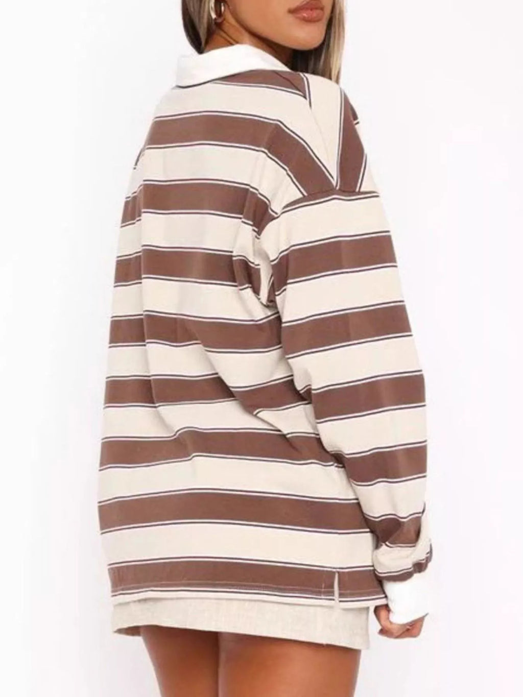 Striped long sleeve polo shirt with button details from Trendsi, featuring a classic design and comfortable fit.