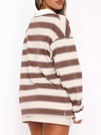 Striped long sleeve polo shirt with button details from Trendsi, featuring a classic design and comfortable fit.